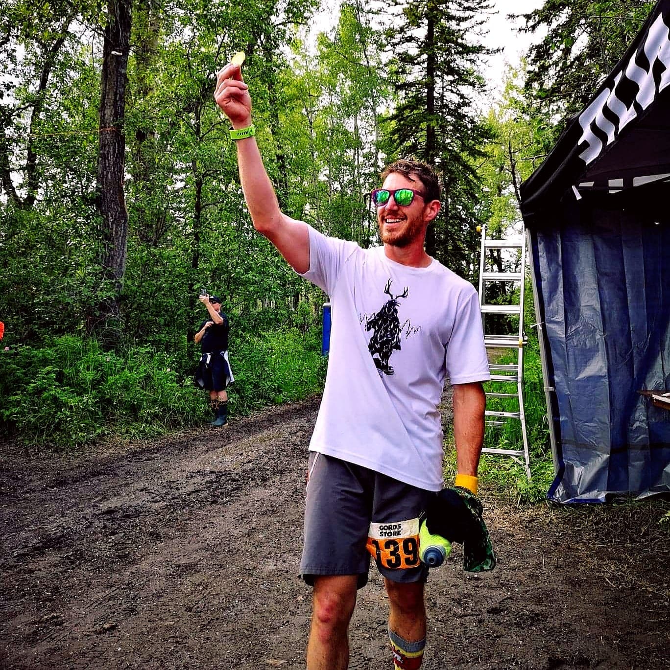 Matt Shepard holding up the golden ticket he won at the Outrun Rare Backyard Ultra